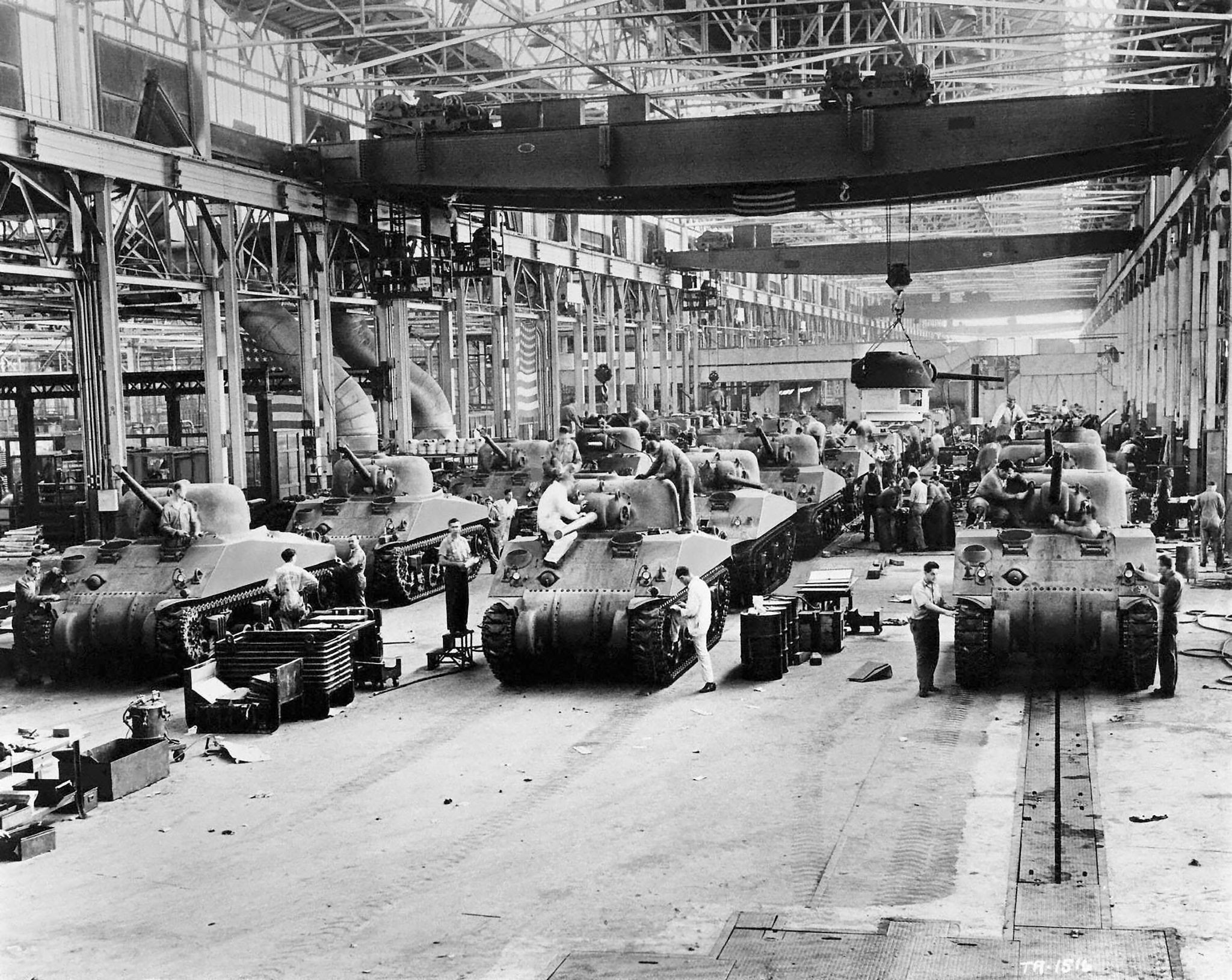 american tank factory with m4 sherman tanks on the assembly floor