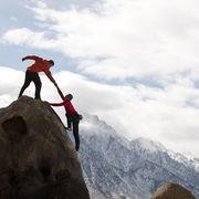 bible verses about trust  person helping another up a mountain