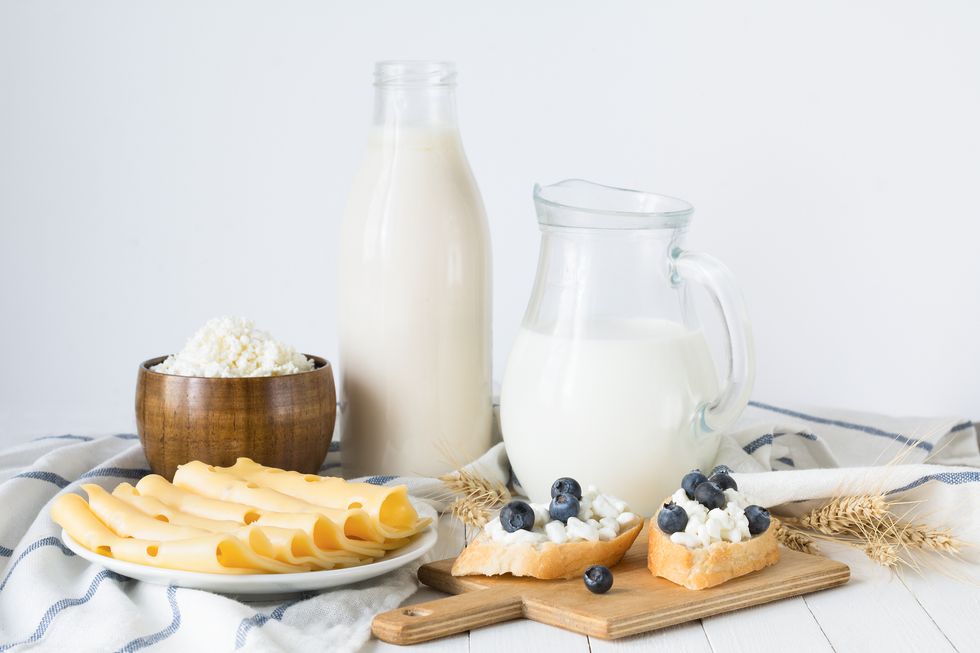 assorted farmers dairy products on white table
