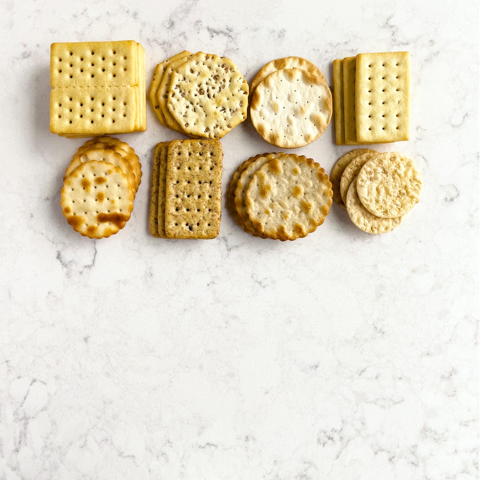 Assortment of crackers on white, marble background assortment of crackers on white, marble background