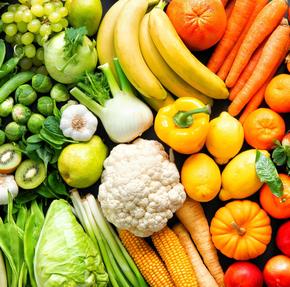 assortment of fresh organic fruits and vegetables in rainbow colors