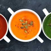 assortment of fresh vegetable soup on a dark background