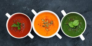 assortment of fresh vegetable soup on a dark background