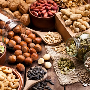 Assortment of nuts on rustic wood table. assortment of nuts on rustic wood table