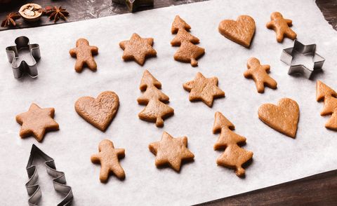 Assortment of raw gingerbread cookies and metal cutters