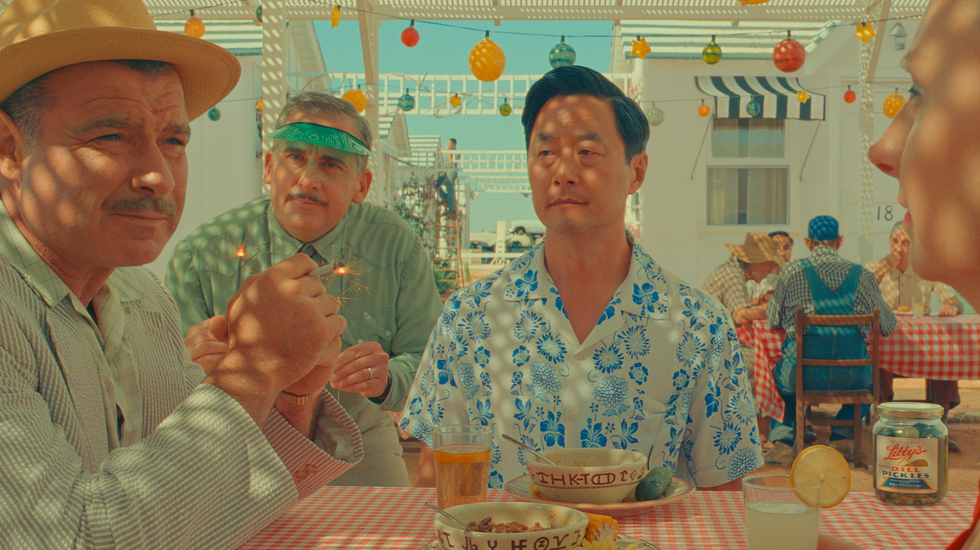 Liev Schreiber as J.J. Kellogg, Steve Carell as motel manager, Stephen Park as Roger Cho and Hope Davis as Sandy Borden in Wes Anderson's Asteroid City