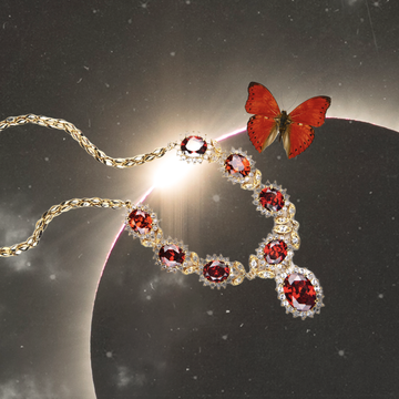 a lunar eclipse collaged with a red butterfly and a ruby necklace