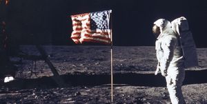 Astronaut Edwin E Aldrin Jr Poses For A Photograph Beside The Deployed Flag Of The United States