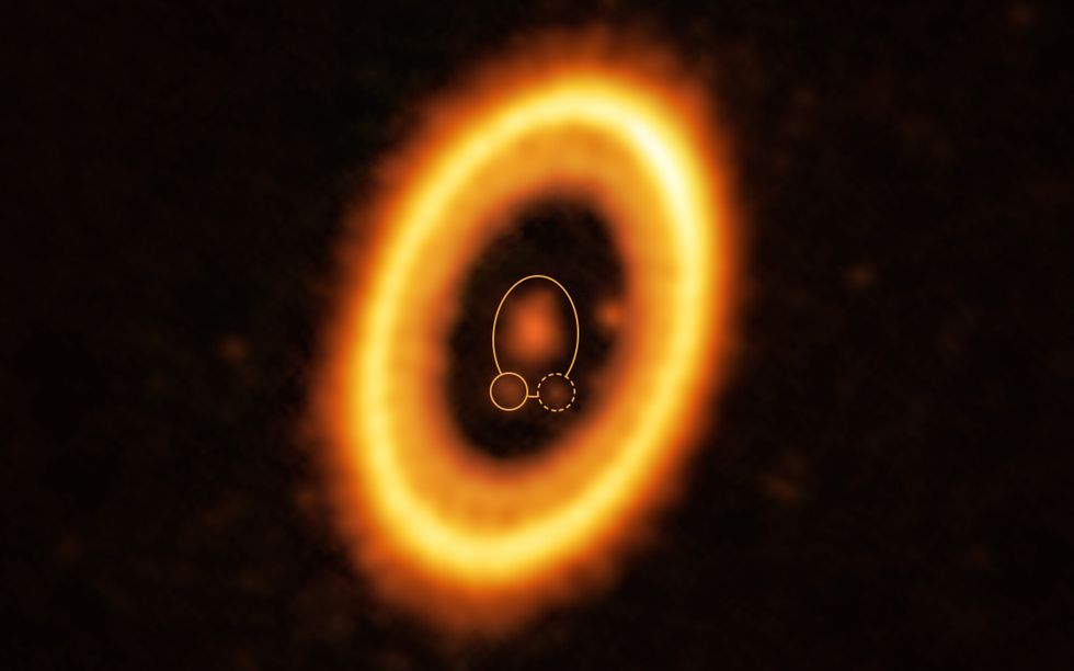 pds 70 galaxy image created using alma with the newly discovered debris cloud surrounded by a dotted line