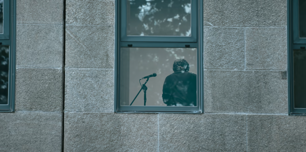 a person looking out a window
