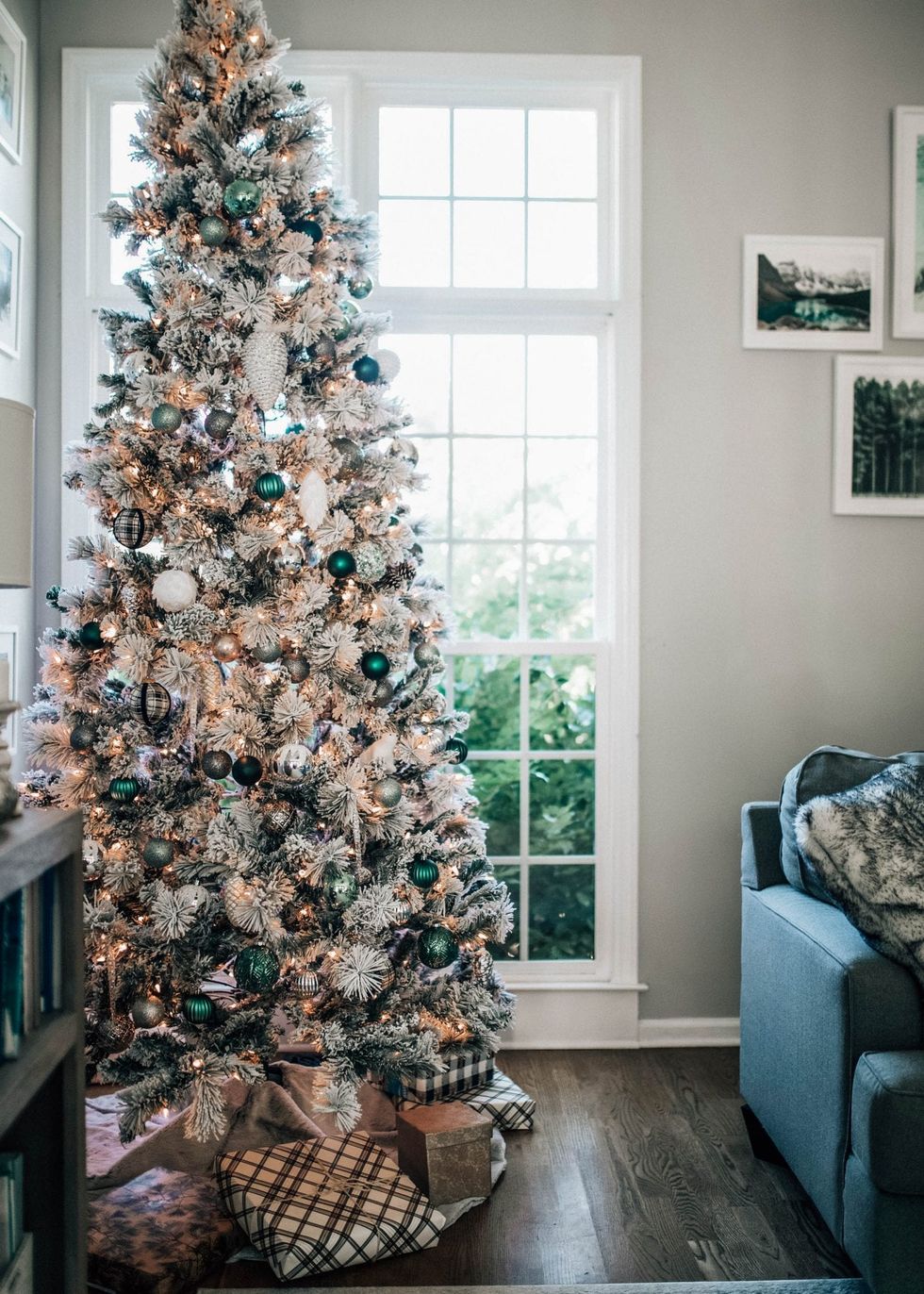 a christmas tree with dark green and black and white ornaments