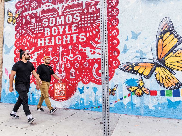 hector arias’s doordash sponsored mural in boyle heights depicts papel picado, perforated paper banners, to celebrate latinx culture