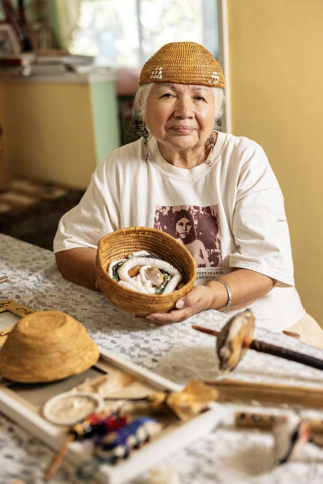 delia  dee dominguez, a member of the kitanemuk and yowlumne tribes who gives talks on toypurina’s legacy she holds a bowl she made full of white clamshell beads, traditionally used as money