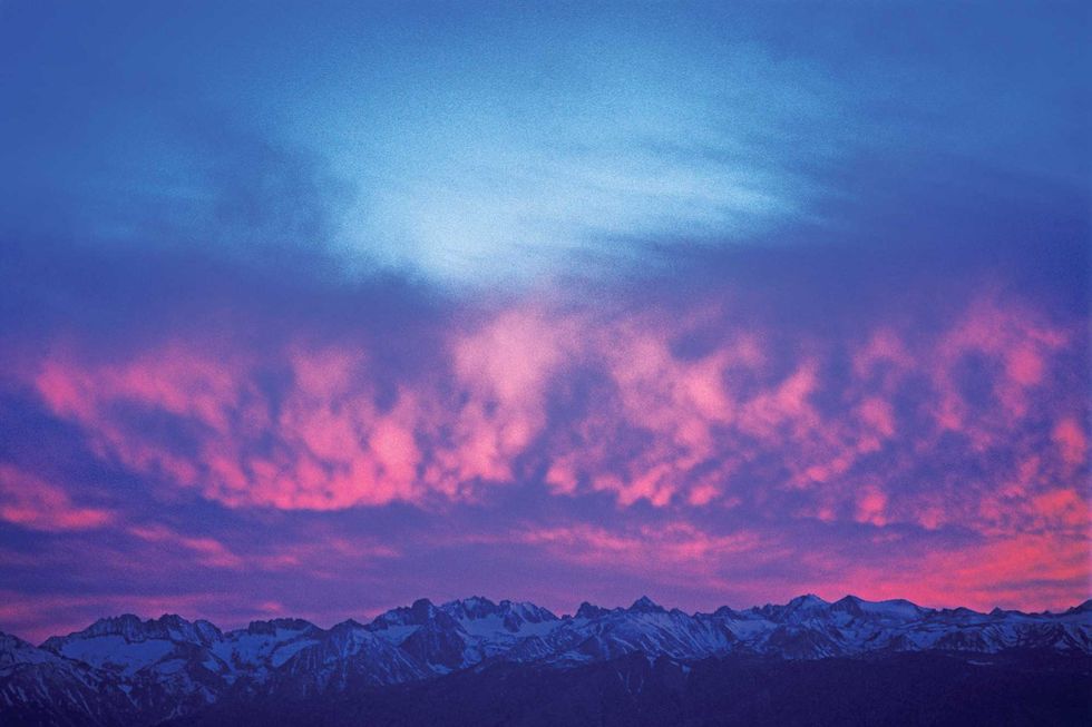 clouds glow at sunset above the eastern sierra palisade glacier region, as viewed from the nearby white mountains