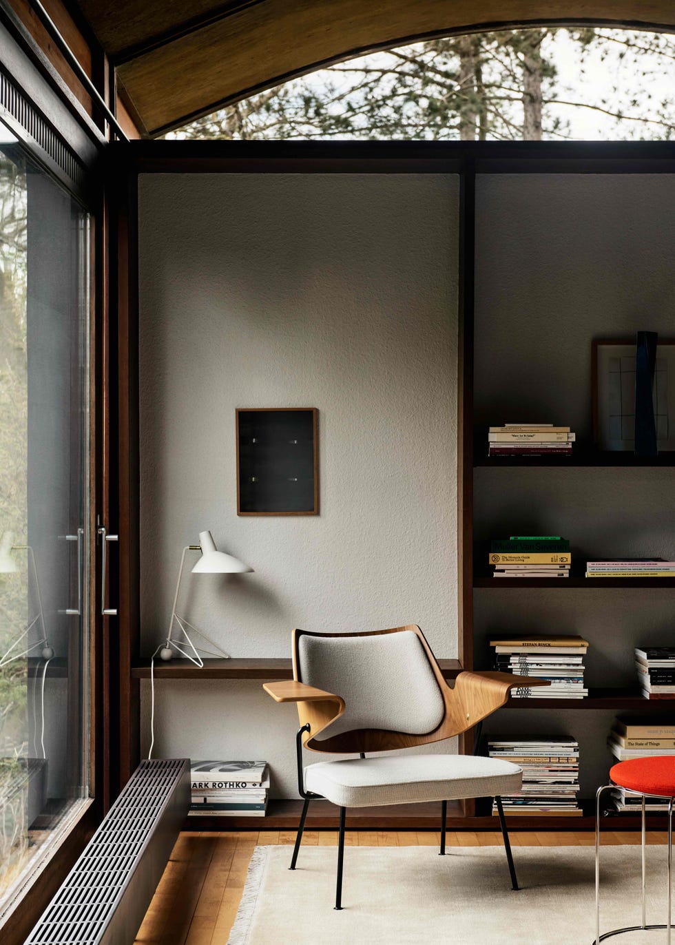an armchair in the corner of a study room