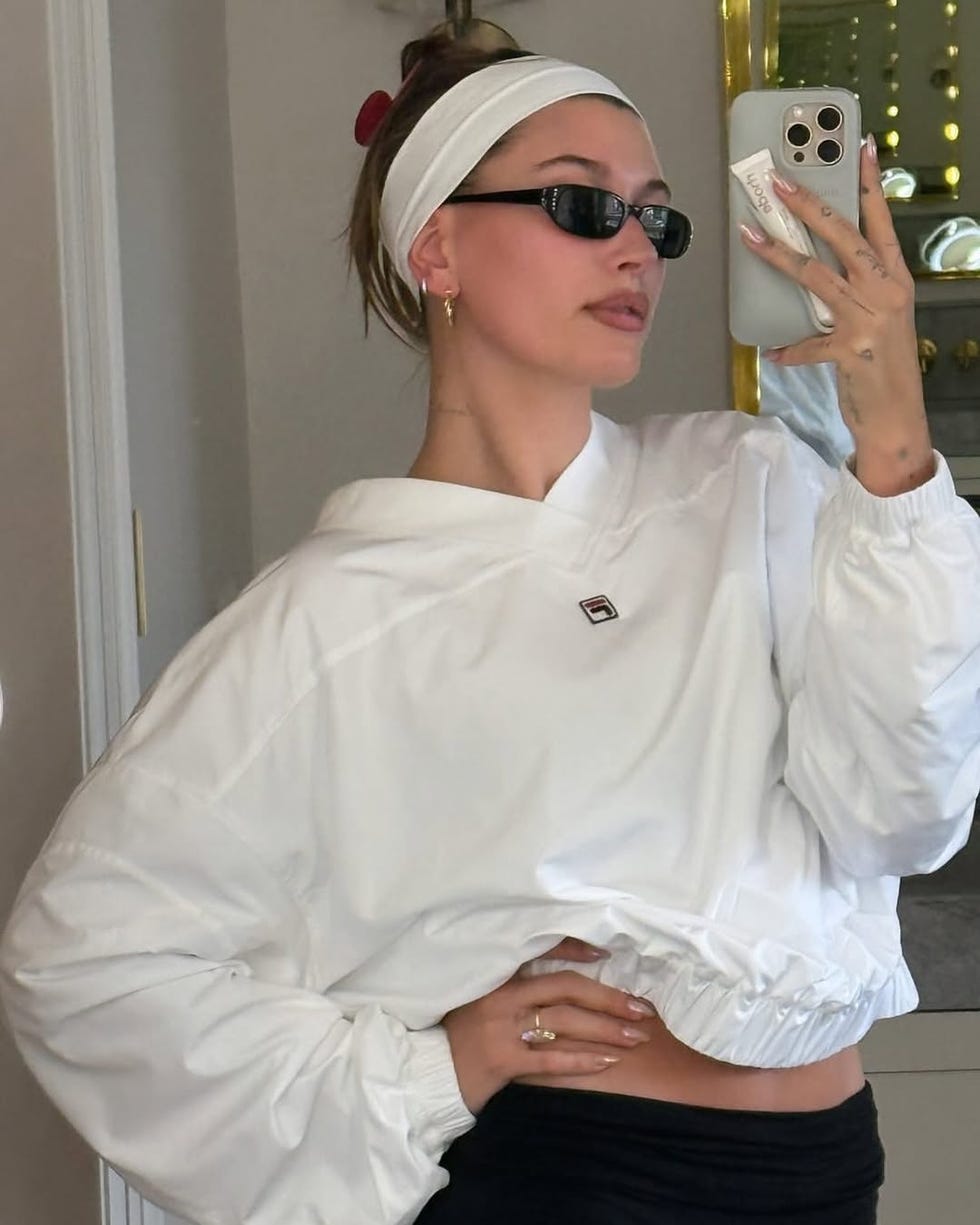 casual outfit featuring a white sweatshirt and black leggings