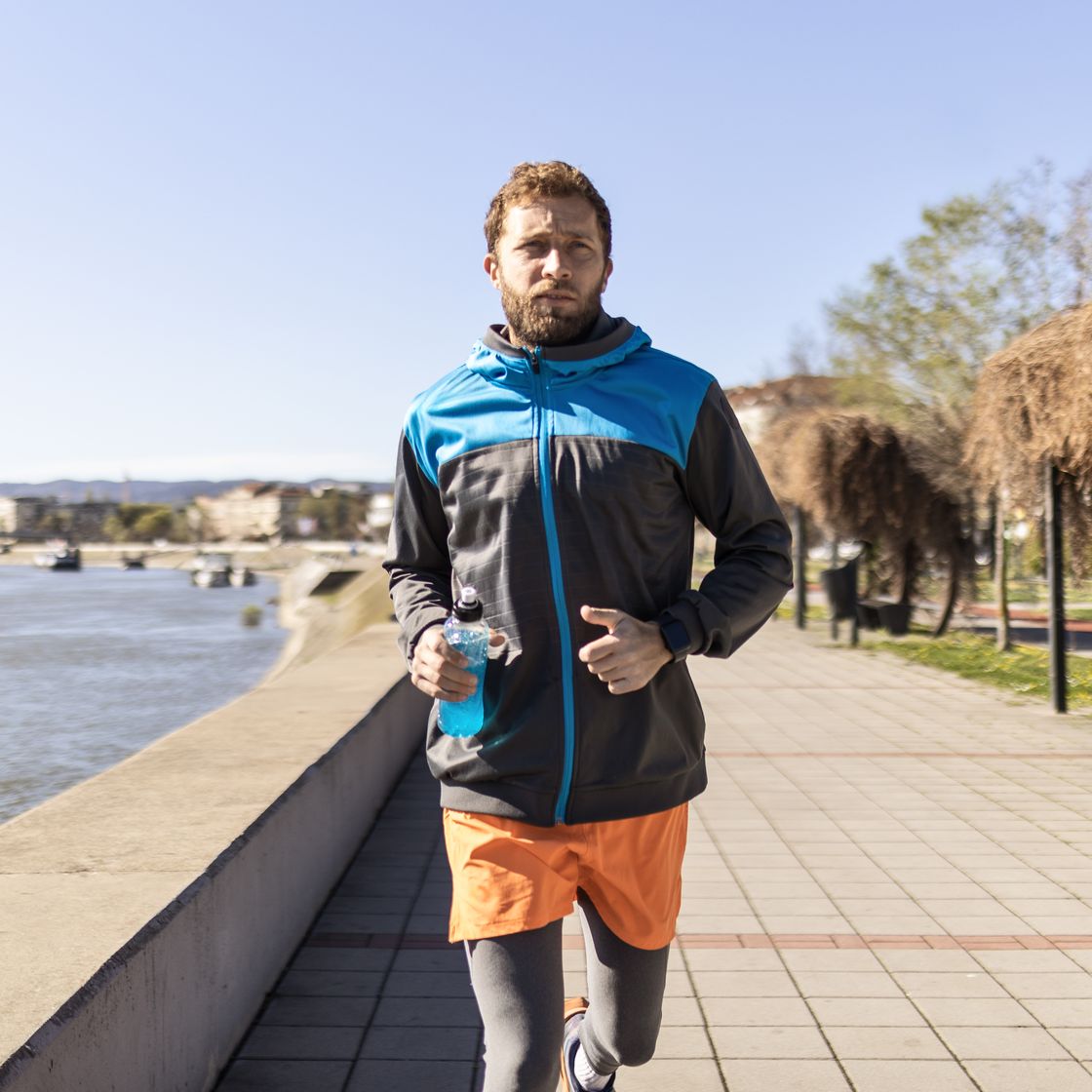 athlete jogging near the river