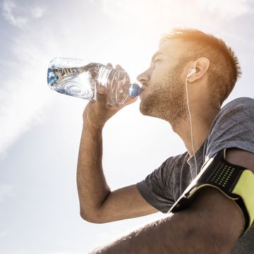 athlete resting and refreshing with water