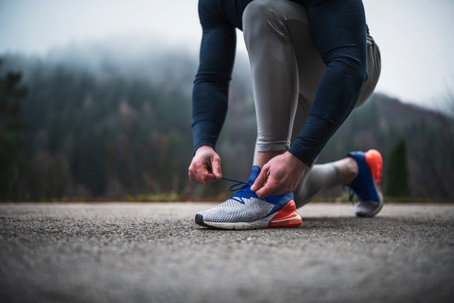 athlete tying shoelace outdoor