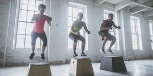 athletes jumping on platforms in gym