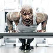athletic black man exercising indoors