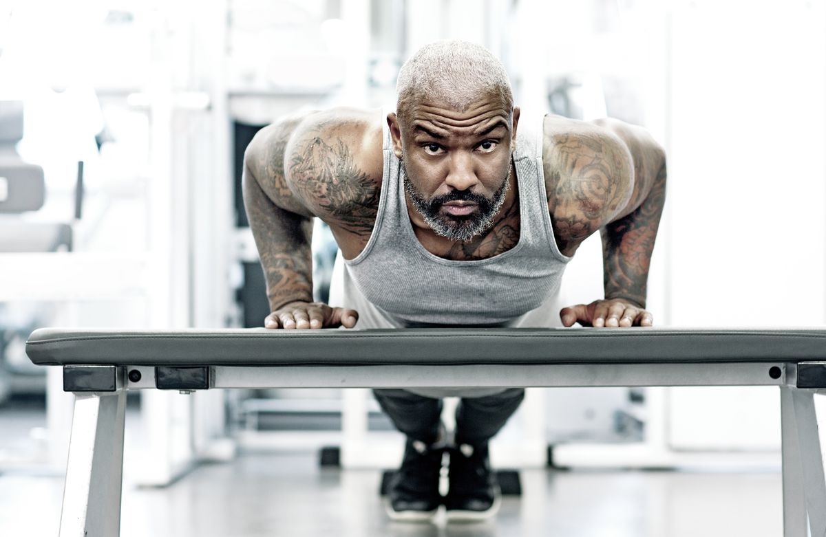athletic black man exercising indoors