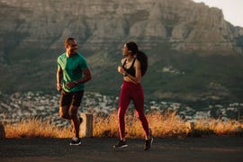 athletic couple on a long distance run