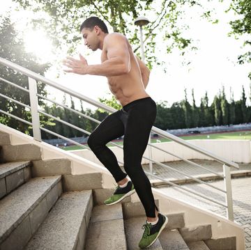 athletic sport runner man running up stairs in urban training