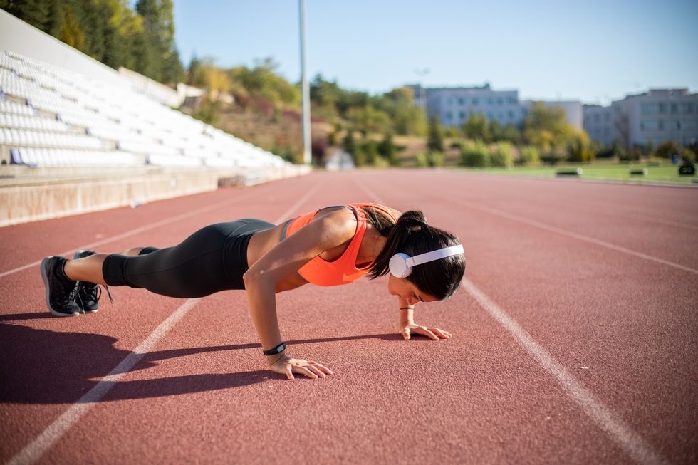 athletic woman exercising push ups