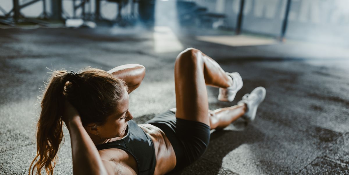 https://hips.hearstapps.com/hmg-prod/images/athletic-woman-exercising-sit-ups-in-a-health-club-royalty-free-image-1749297049.pjpeg?crop=1.00xw:0.752xh;0,0.144xh&resize=1200:*