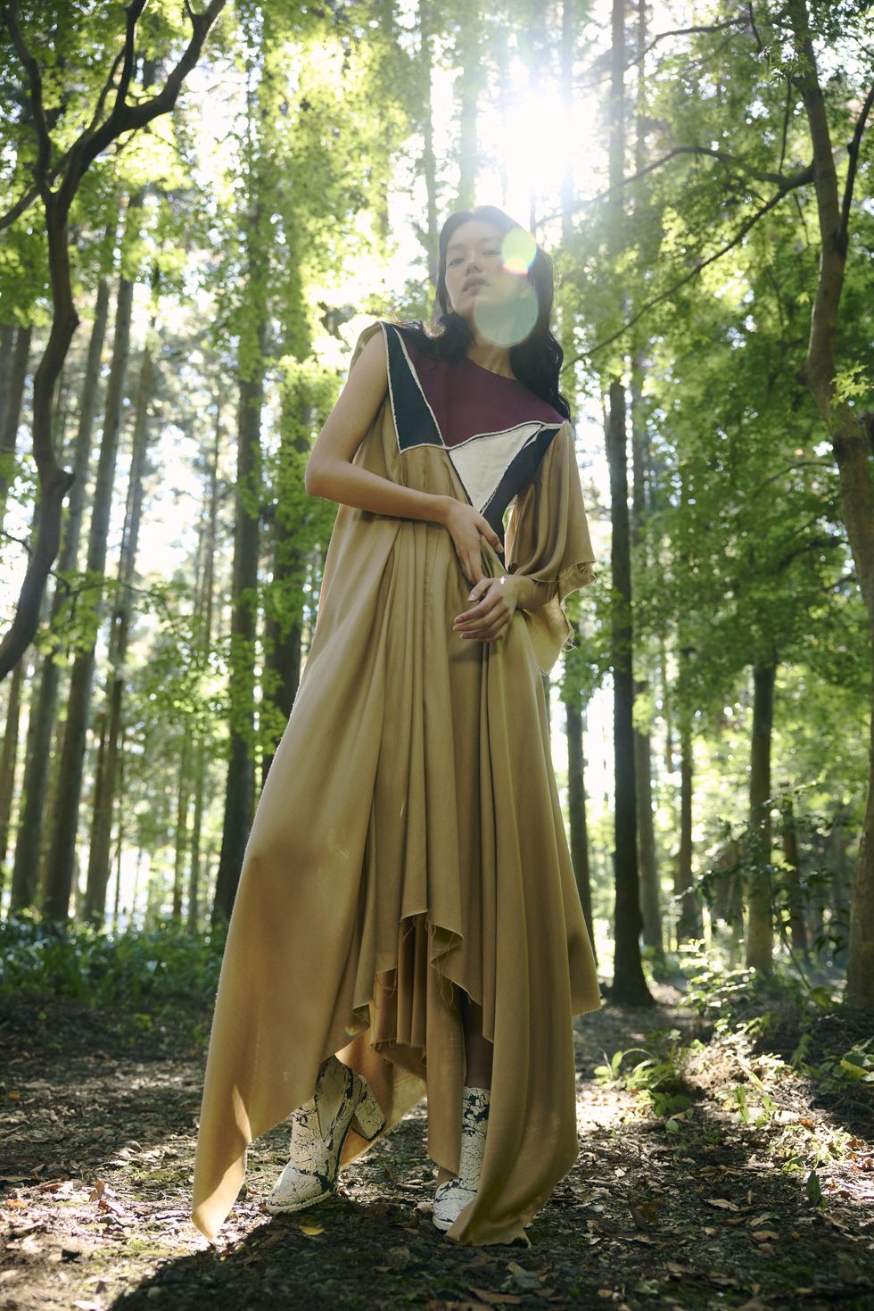 a person in a dress in the woods