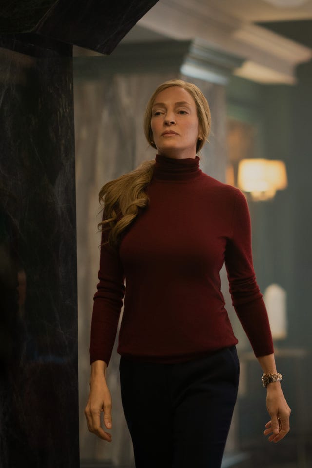 Person walking in a sophisticated indoor setting