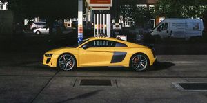 Vehicle, Yellow, Car, Automotive design, Filling station, Sky, Supercar, Luxury vehicle, Sports car, Building, 