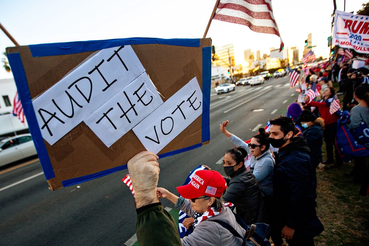 beverly hills, ca   november 07 a trump supporter holds a sign that says audit the vote at a trump rally in beverly hills as joe biden is elected president on saturday, nov 7, 2020 in beverly hills, ca jason armond  los angeles times