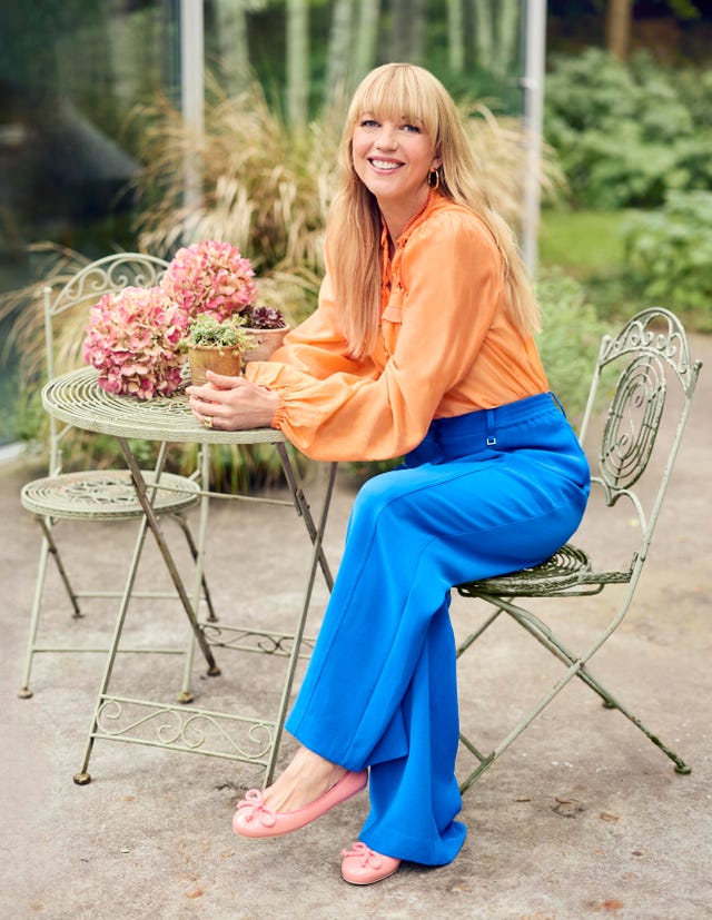 sara cox sitting at a table