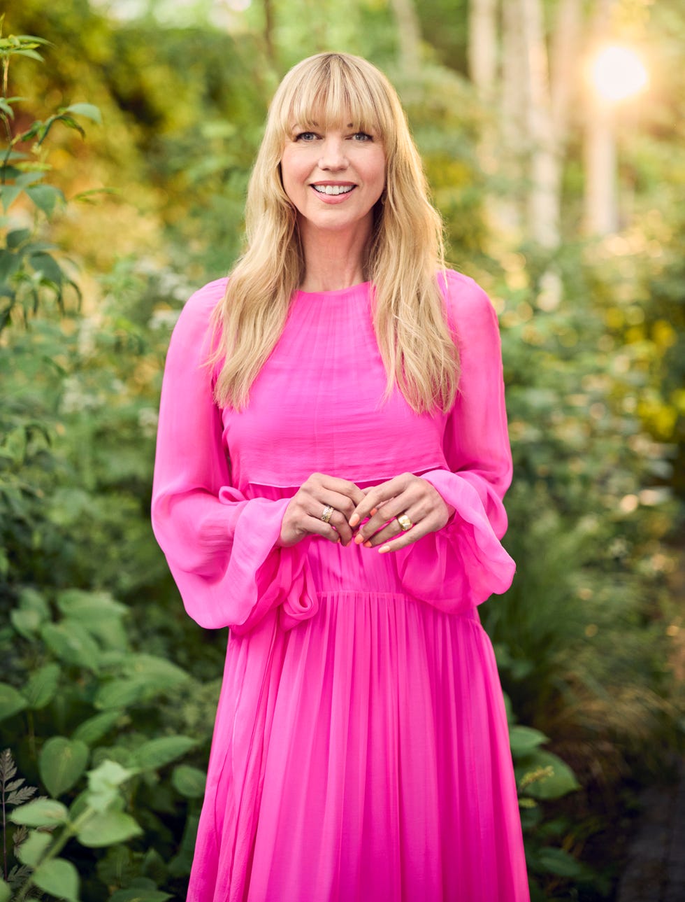 sara cox wearing a pink dress