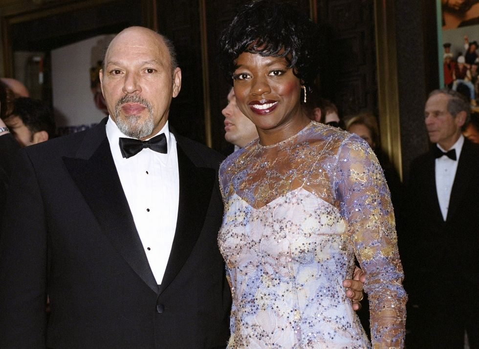 august wilson, wearing a tuxedo, and viola davis, wearing a white and purple dress, arriving at radio city music hall for the 55th tony awards