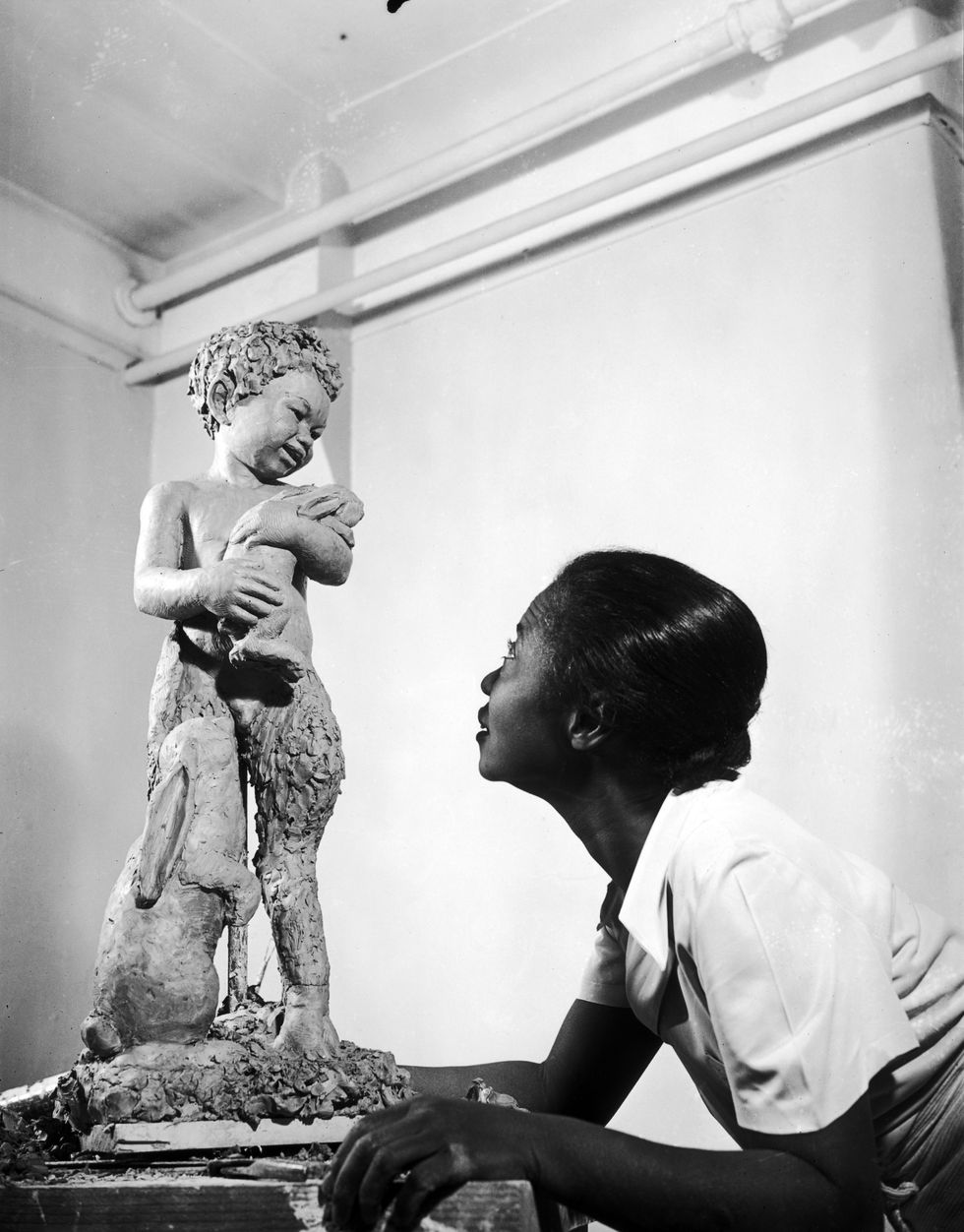 Augusta Savage working on a piece, New York, NY, 1938