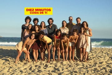 group of people posing on the beach