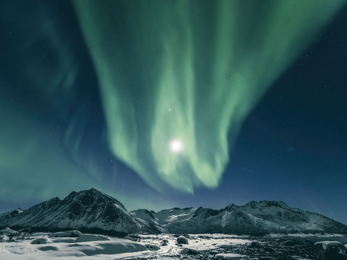 https://hips.hearstapps.com/hmg-prod/images/aurora-northern-polar-light-in-night-sky-over-royalty-free-image-1684919075.jpg?crop=0.88973xw:1xh;center,top&resize=1200:*