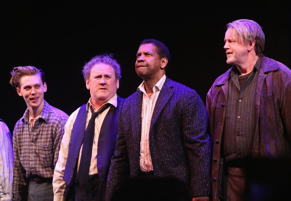 austin butler, colm ﻿meaney, denzel washington, and ﻿david more standing together on a stage looking outward