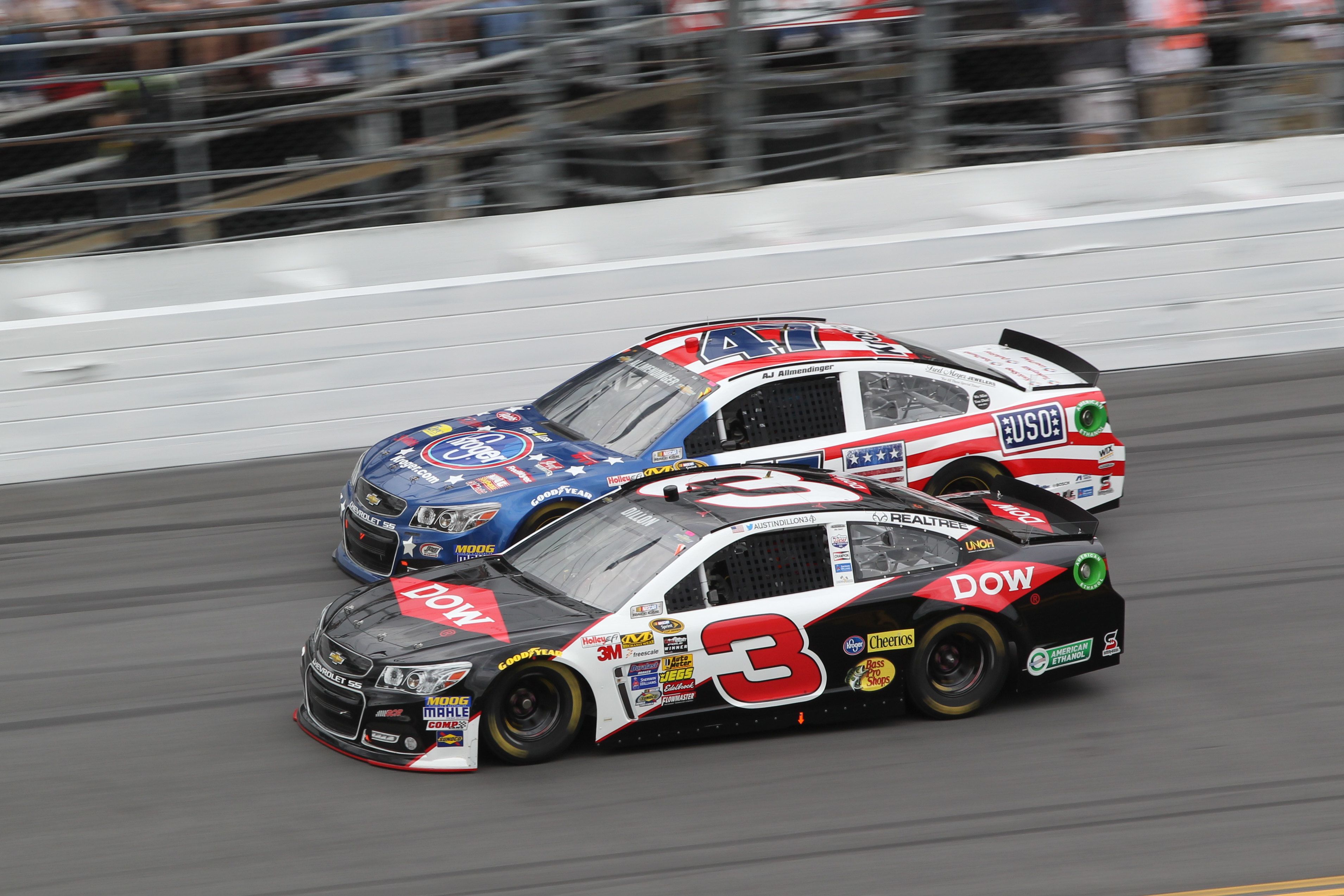 ATLANTA, GA - JULY 09: Kevin Harvick (#4 Stewart Haas Racing Hunt Brothers  Pizza Ford) and Austin Dillon (#3 Richard Childress Racing Dow Salutes  Veterans Chevrolet) race side by side during the