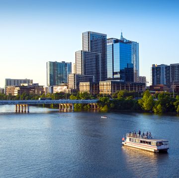 lady bird lake is a water reservoir on the colorado river in downtown austin and very popular with recreational boaters and tour boats viewing the waterfront