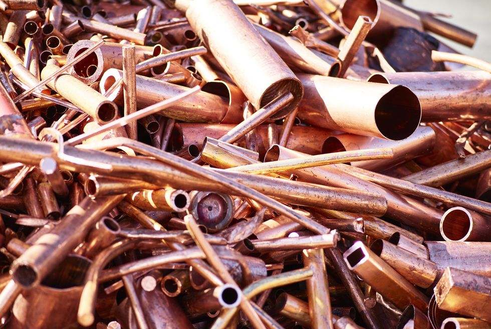 closeup of copper pipes in junkyard