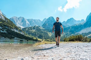 austria, tyrol, man hiking at seebensee lake