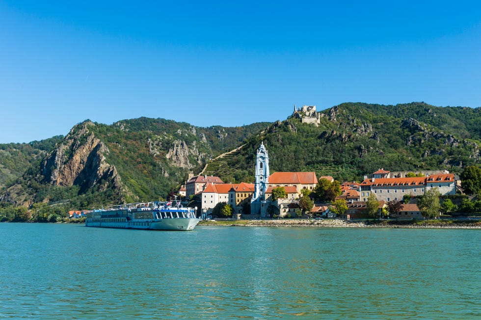 austria, wachau, cruise ship passing duernstein on the danube