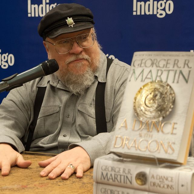 george rr martin signs copies of his new book "a dance with dragons"