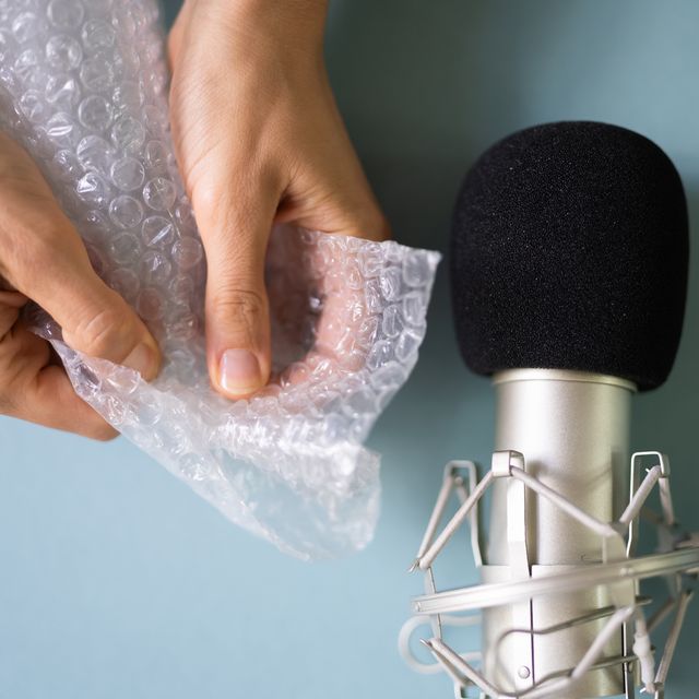 microphone next to a pair of hands crinkling a sheet of bubble wrap