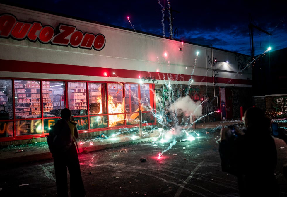 minneapolis, mn   may 27 a firework explodes as a fire burns inside of an auto zone store near the 3rd police precinct on may 27, 2020 in minneapolis, minnesota businesses near the station were looted and damaged today as the area has become the site of an ongoing protest after the police killing of george floyd four minneapolis police officers have been fired after a video taken by a bystander was posted on social media showing floyd's neck being pinned to the ground by an officer as he repeatedly said, "i can‚Äôt breathe" floyd was later pronounced dead while in police custody after being transported to hennepin county medical center  photo by stephen maturengetty images