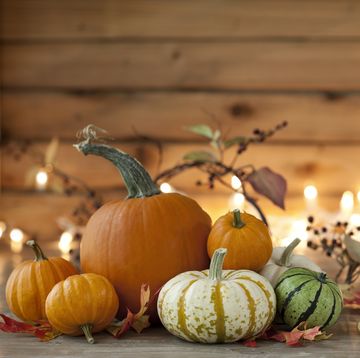 autumn pumpkin arrangement on a wood background